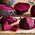 Sliced beets on a cutting boardready to be used in our Best Pickled Beet Recipe