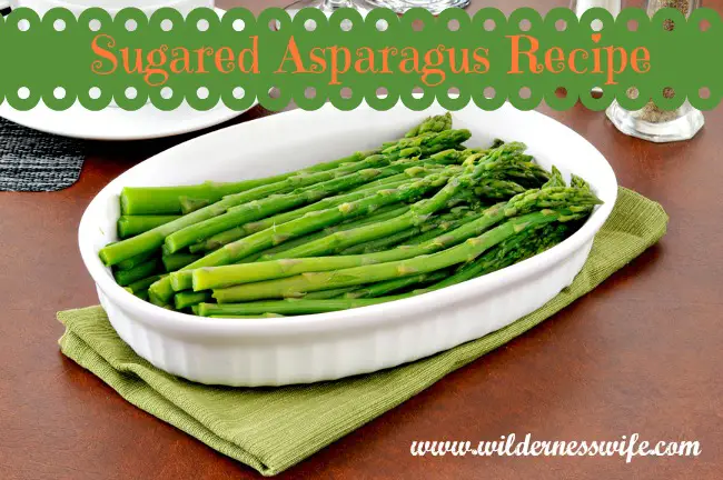 Sugared asparagus side dish served in a white dish.