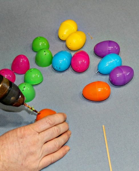 How to make an Easter Egg Tree - drill holes in the plastic Easter Eggs