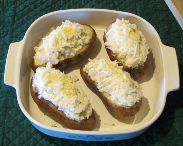 Potatoes stuffed and ready for the oven.