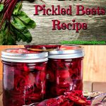 Beets fresh from the garden resting on a cutting board and jars of canned pickled beets in back of a glass dish full of sliced pickled beets.
