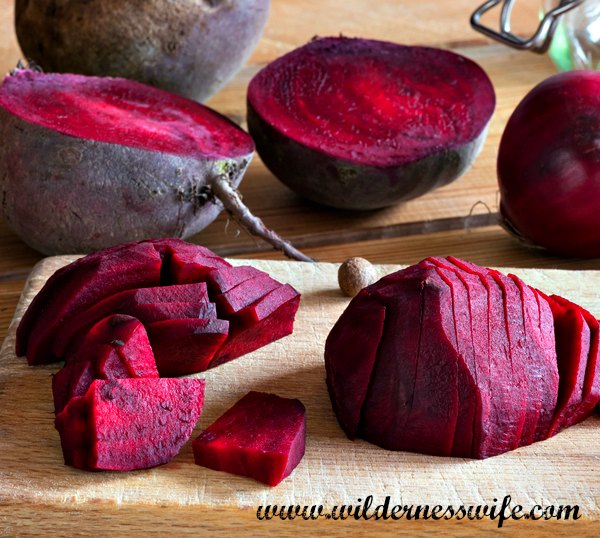 Sliced beets on a cutting board ready to be used in our Recipe