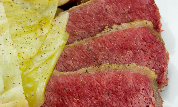 Plate of Corned Beef & Cabbage with carrots and potatoes