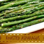 Easy roasted asparagus on a white plate.