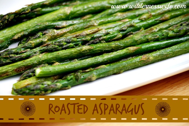 Easy roasted asparagus on a white plate.