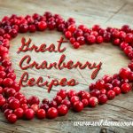 fresh canberries shaped in a heart on a grey wooden table