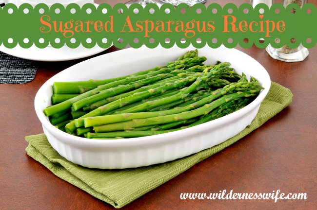 Sugared asparagus side dish served in a white dish.