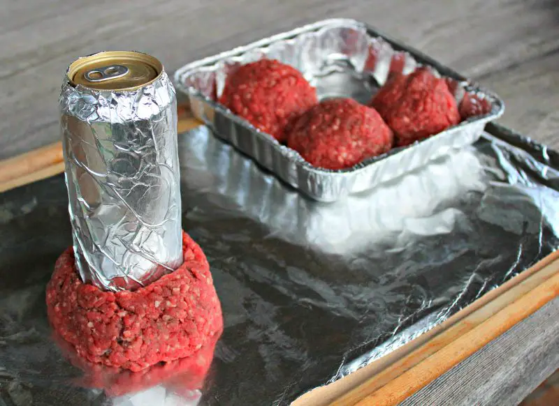 The hamburg must be shaped around a beer can wrapped in aluminum foil to make your Beer Can Burger