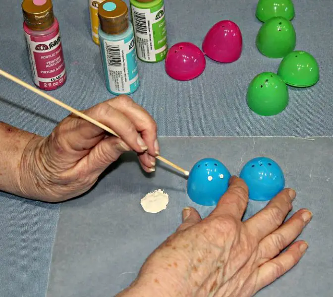 How to make an Easter Egg Tree - decorating the plastic Easter Eggs with acrylic paint and a dowel.