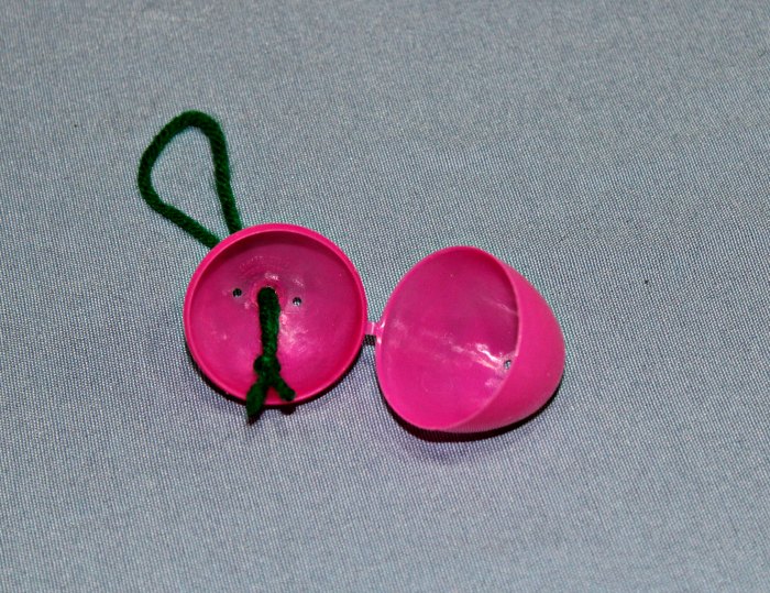 How to make an Easter Egg Tree - Insert the string to hang the Easter Egg.