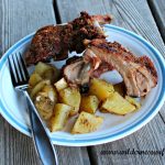 Plate of grill=smoked Back Ribs with herbed potatoes