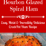 A beautiful mahogany colored baked spiral ham glazed with an orange Bourbon sauce