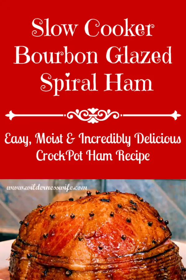 A beautiful mahogany colored baked spiral ham glazed with an orange Bourbon sauce