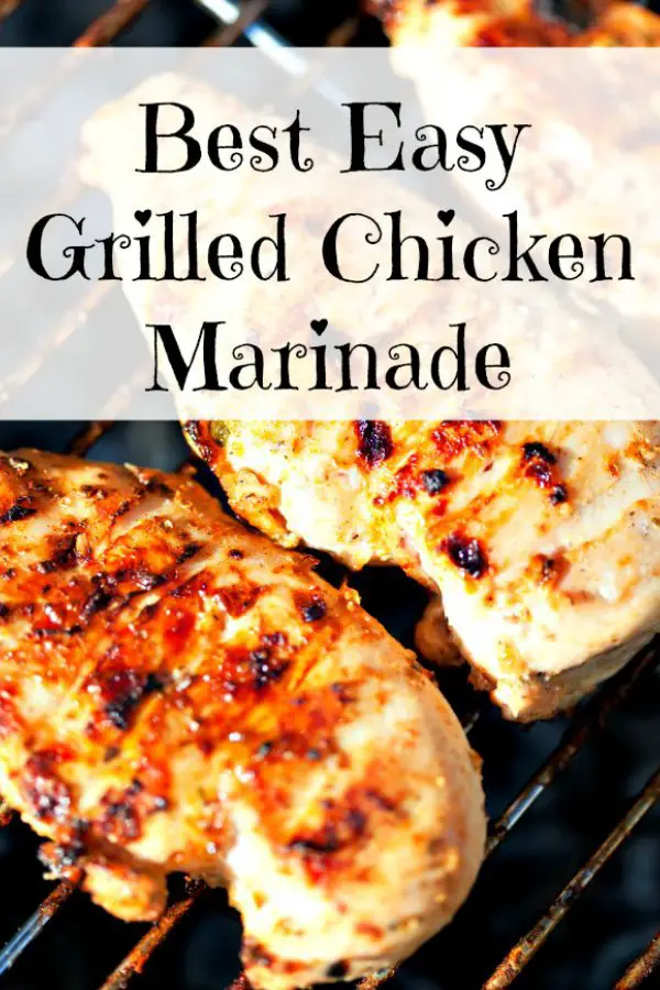 Marinated boneless chicken breasts on a gas grill cooking to grilled perfection