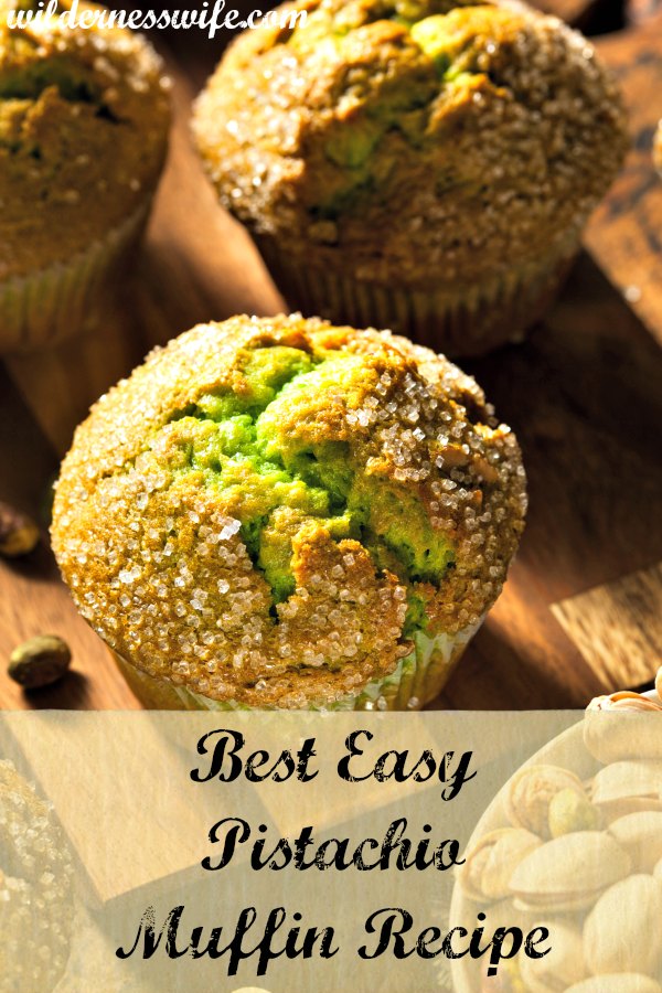 3 pistachio muffins made from my easy and moist pistachio muffin recipe cooling on a cutting board