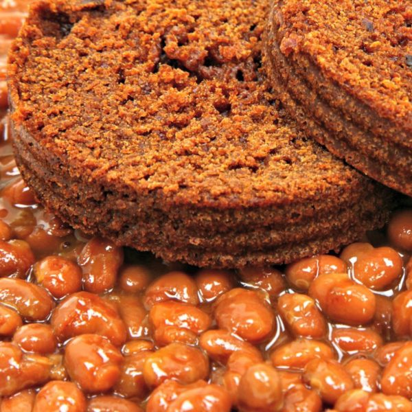 Plate of Boston Baked Beans served with homemade brown bread