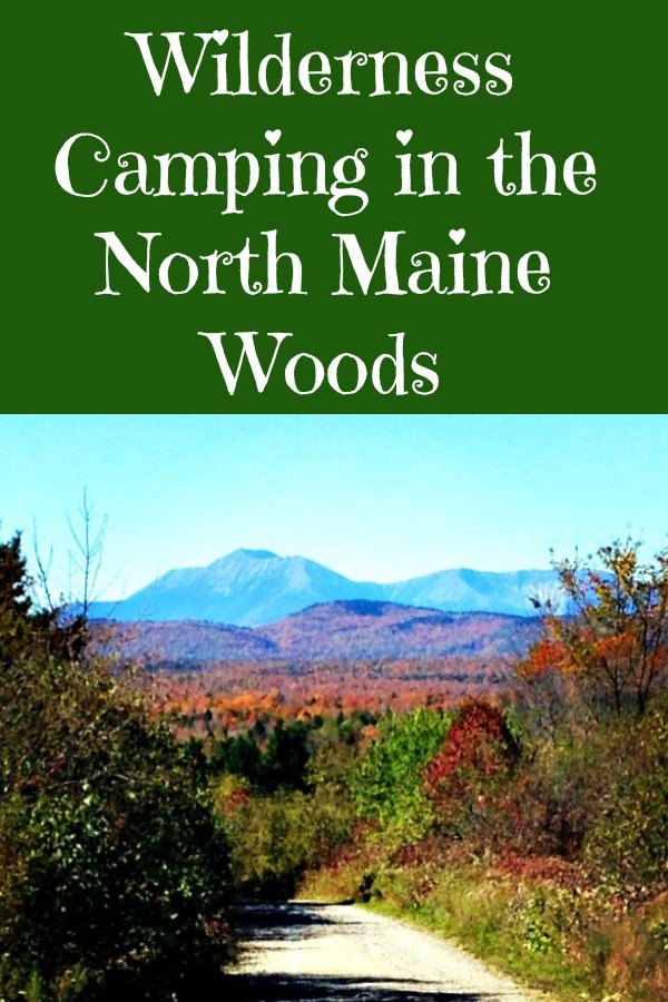 Heading down a Maine North Woods logging road in the fall looking out to Mount Katahdin