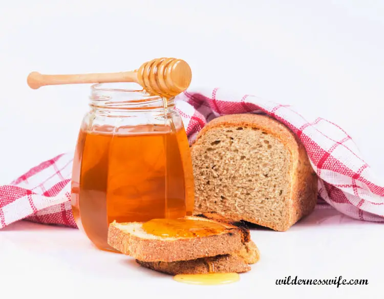 Loaf of Honey Oatmeal Bread with Jar of Honey. Recipe from the 1987 KitchenAid Cook Book.