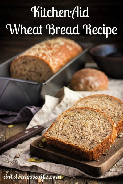 KitchenAid Wheat Bread Recipe shows a loaf and slices on a wood cutting board