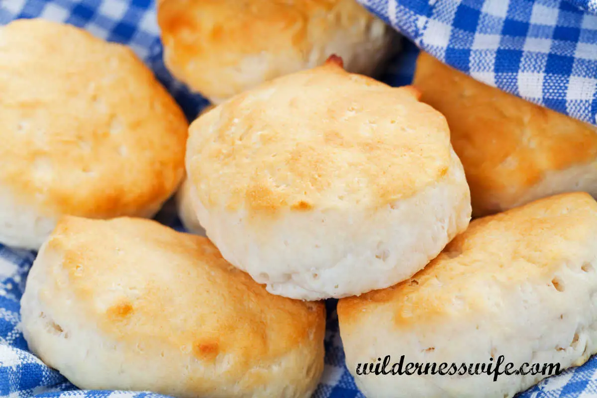 Homemade biscuits in a blue and white checked napkin