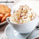 Cup of hot cocoa topped with our homemade whipped cream recipe