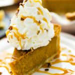 Our pumpkin pie recipe with a large dollop of our homemade whipped cream recipe