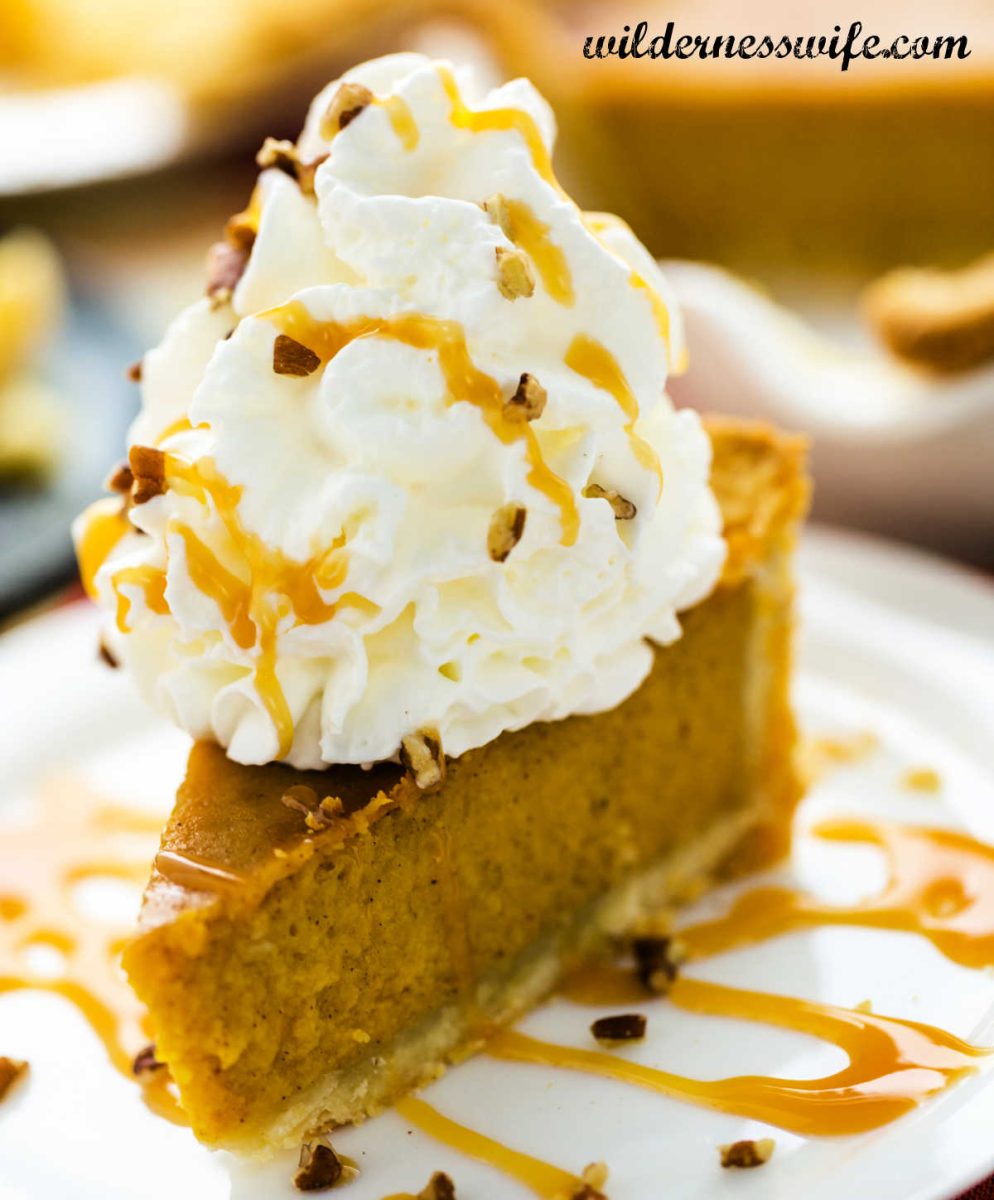 Our pumpkin pie recipe with a large dollop of our homemade whipped cream recipe