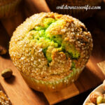 Pistachio muffin on wooden board