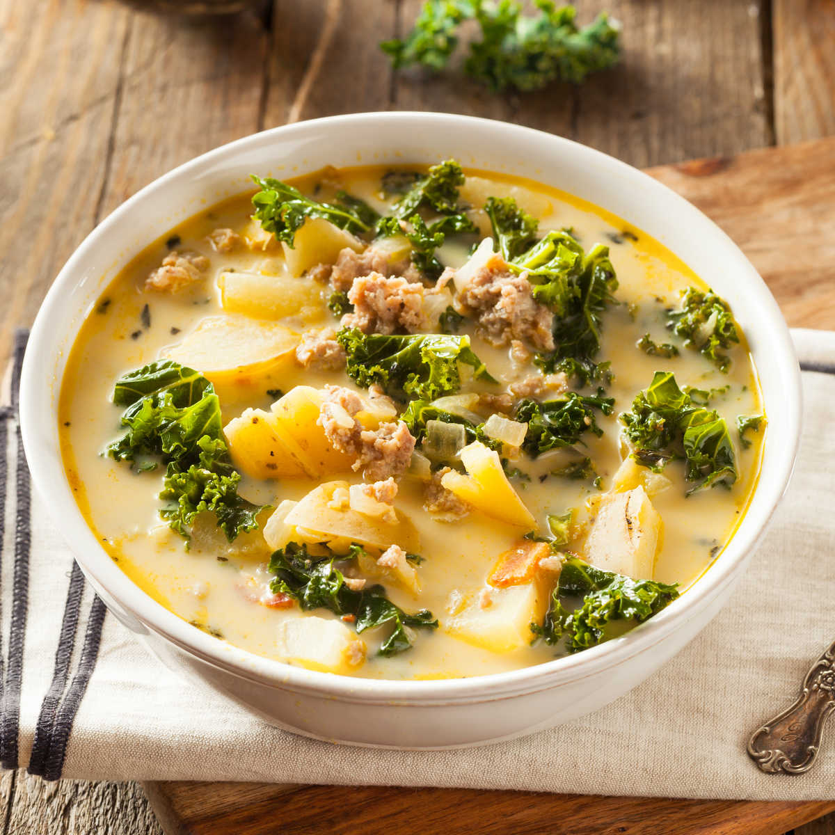 white bowl filled with Olive Garden Zuppa Toscana soup