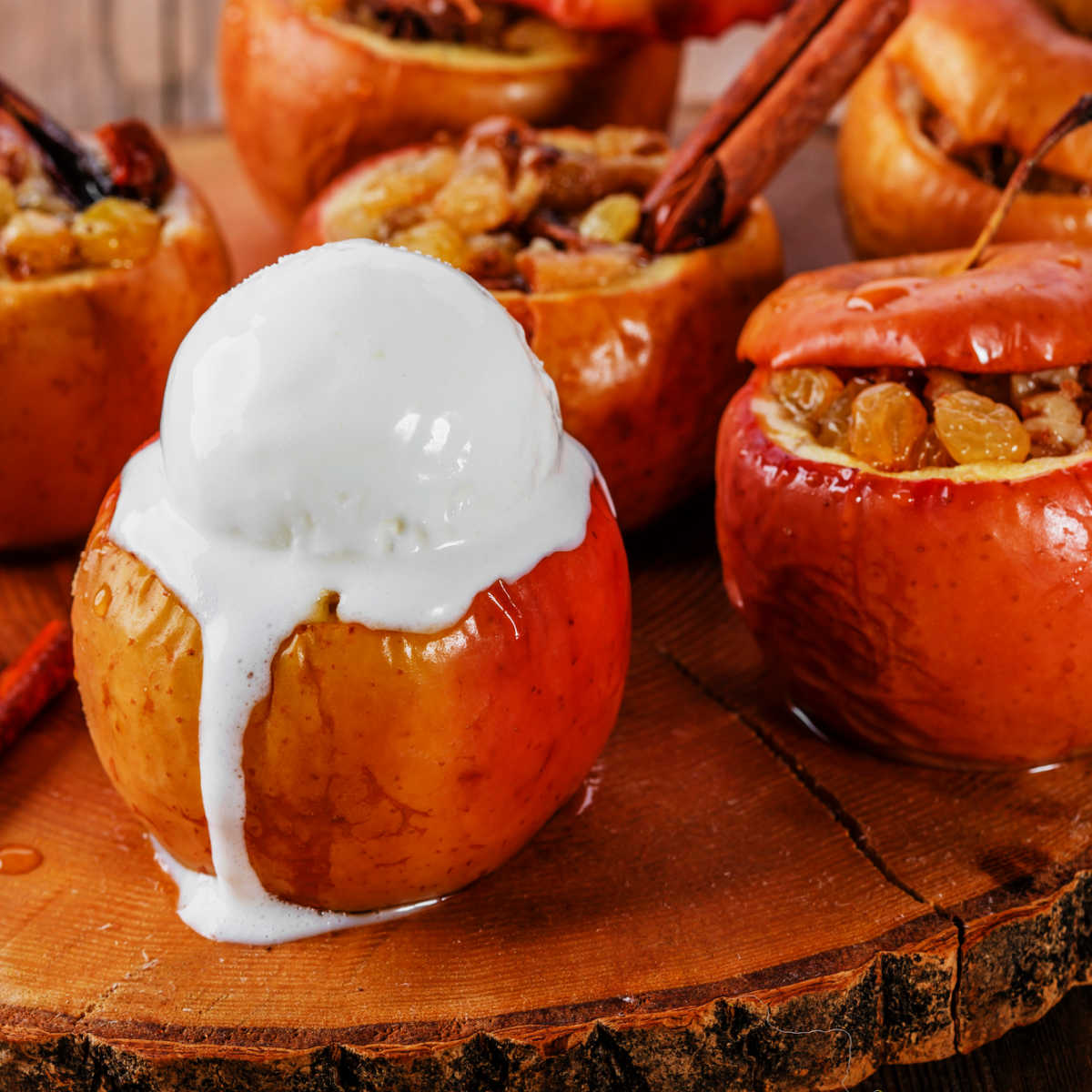 Baked stuffed apple topped with scoop of ice cream