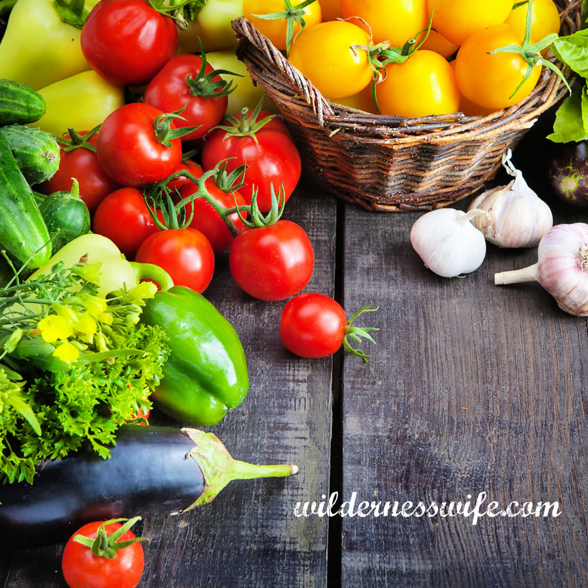 vegetables to be cut up for a vegetable soup displayed on a wood table.