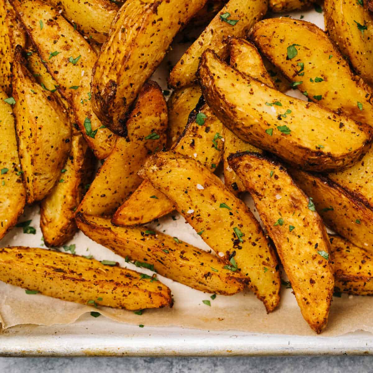 Overhead close-up of Spicy Roasted Potatoes on a white plate